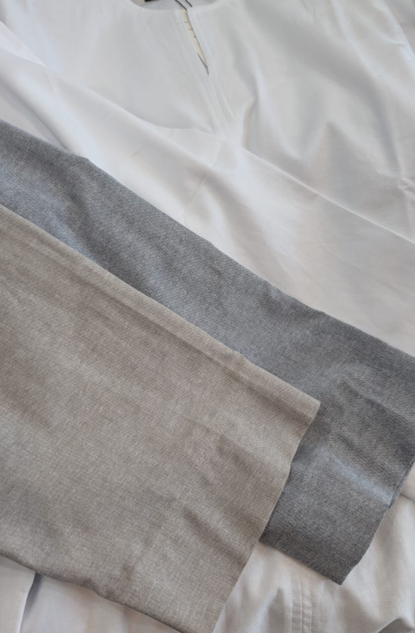Close-up of a gray and beige fabric swatch on a white background